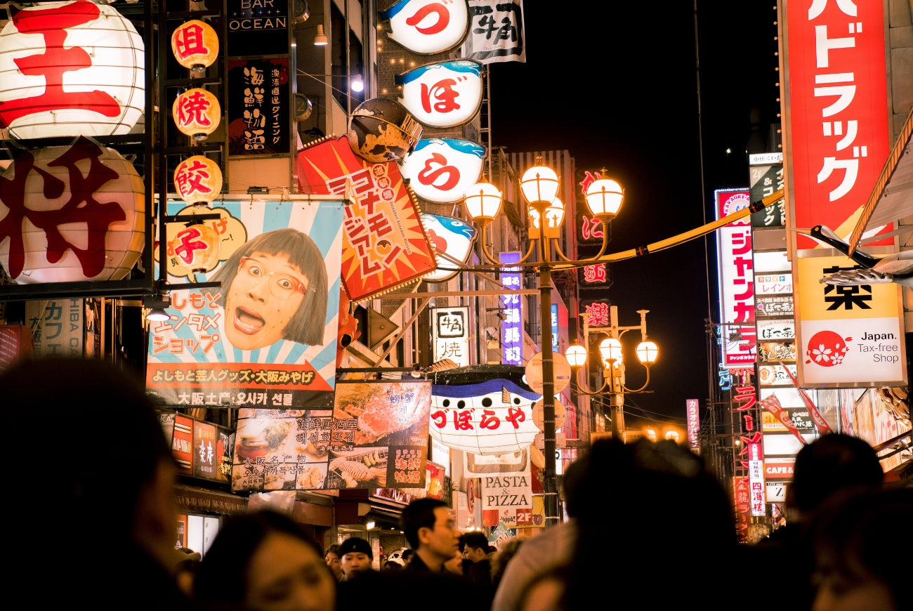 Neon signs and paper lanterns above a crowded Tokyo street at night, header of the Harajuku Journal